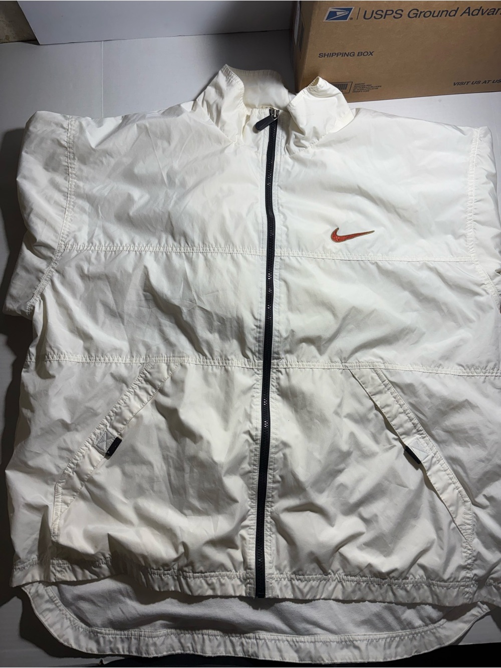 Vintage Nike White Windbreaker with Orange Swoosh Accent